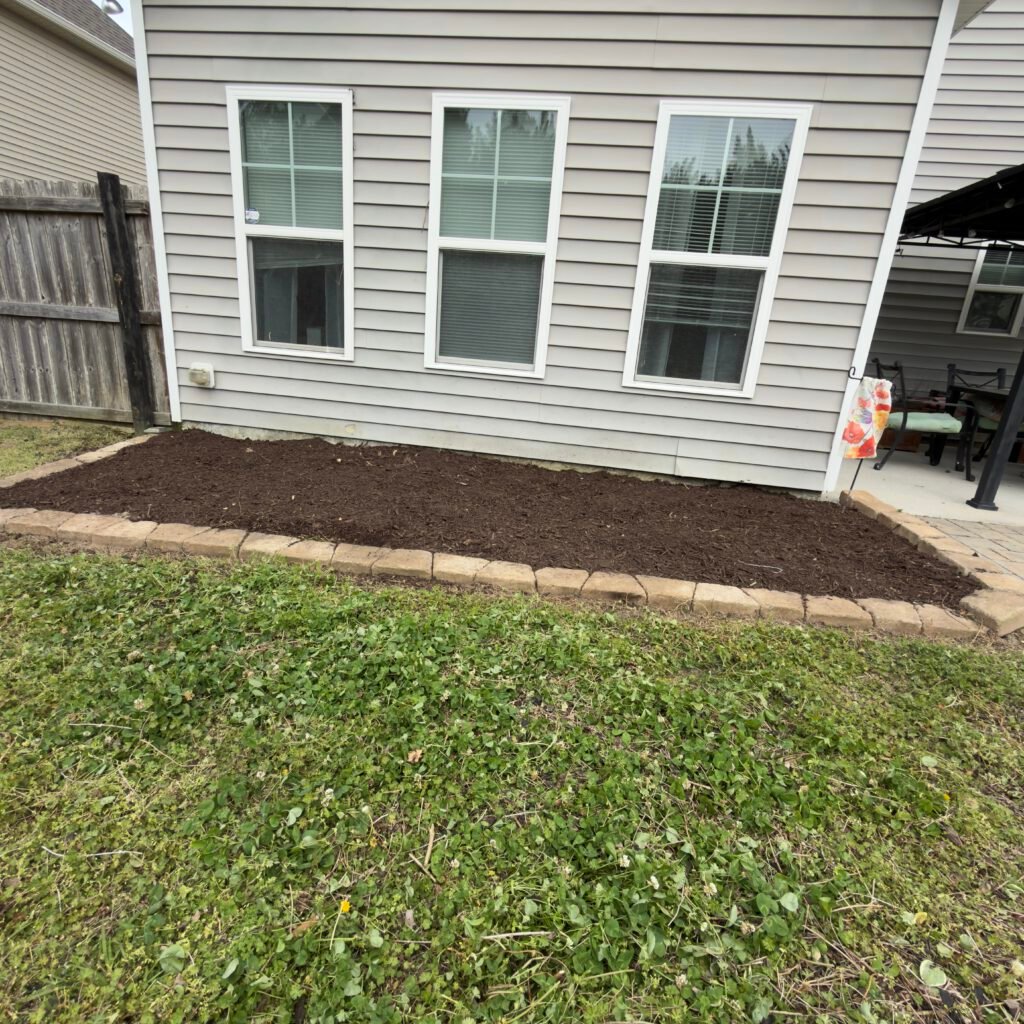 New soil and brickwork for new refreshed planting area