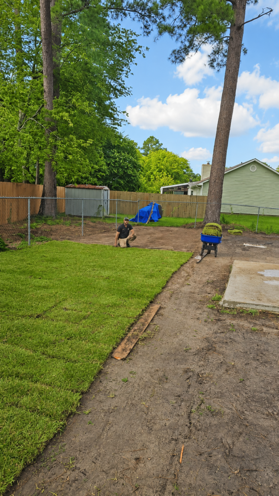 New sod being placed on a cleared piece of property